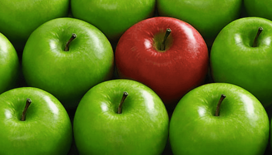 red apple amongst green apples